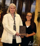 <b>Description: </b>The *El Gohara Perpetual Trophy, sponsored by Dr. Amy Fulmer-Vogel, left, is awarded at the Egyptian Event for the most beautiful expression of the close bond between a riders heart and the soul of a performance horse. <br/><b>Copyright: </b>Rob Hess photography